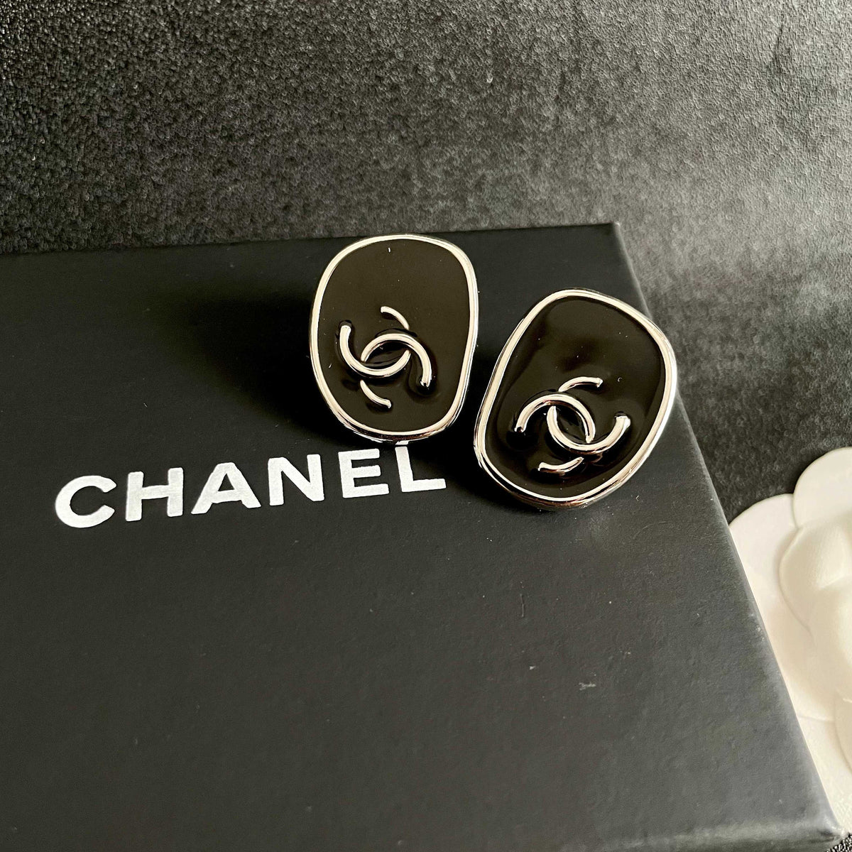 Double-C Emblem Stud Earrings in Polished Metal-Tone – Design 313 detail view