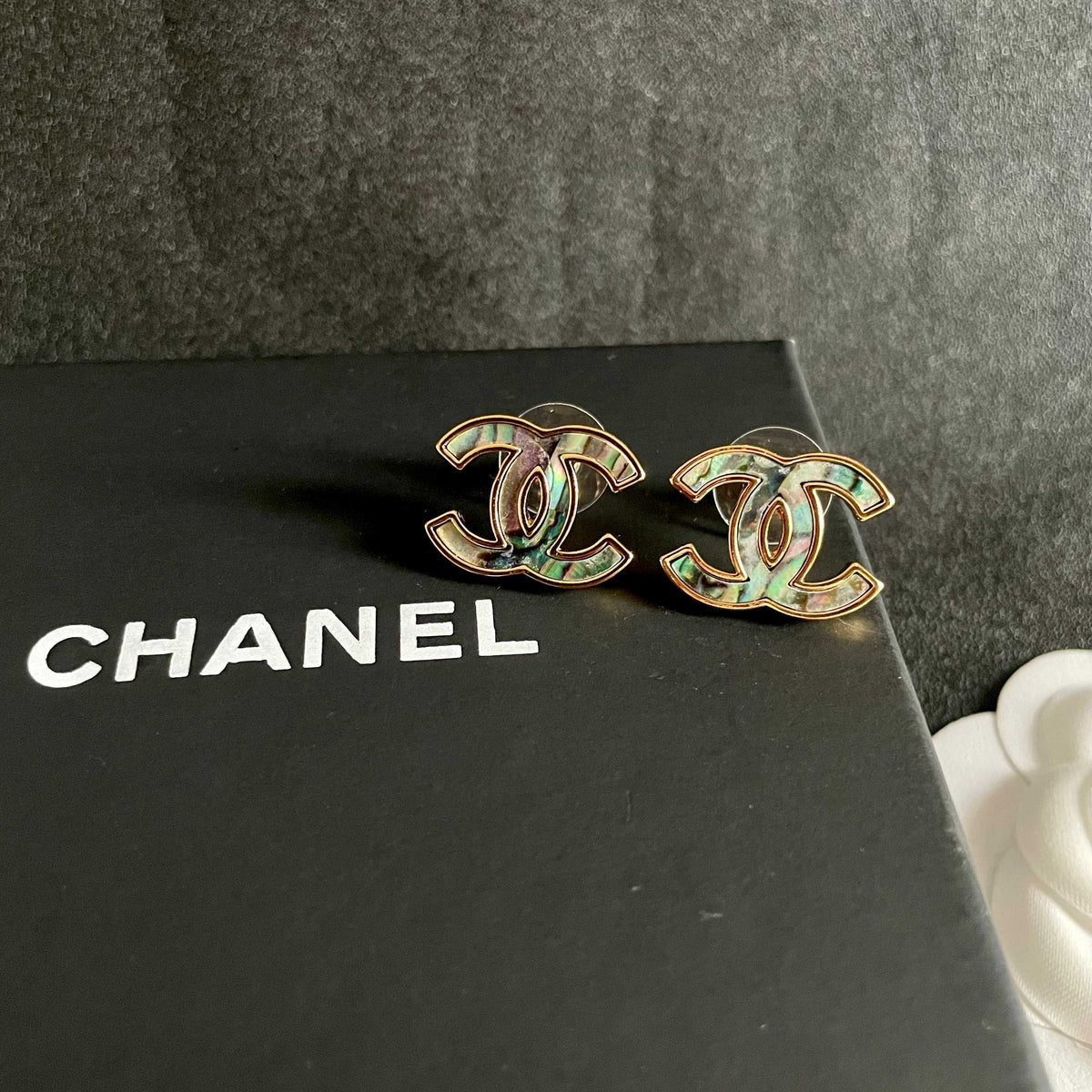 Double-C Emblem Stud Earrings in Polished Metal-Tone – Design 301 detail view