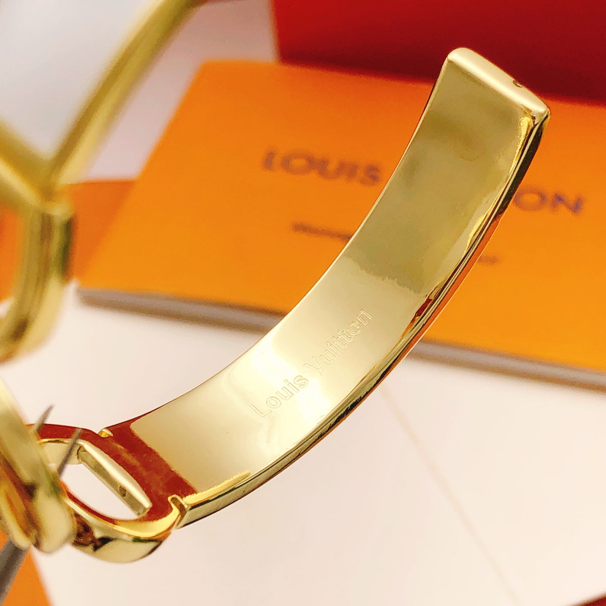 Geometric Emblem Bangle in Gold-Tone – White Detail styled product view