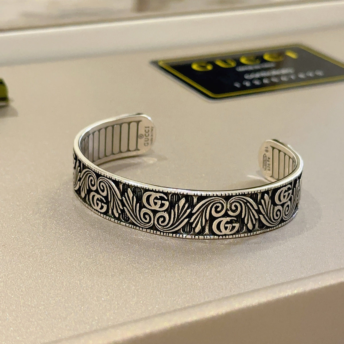 Double-G Emblem Bangle in Polished Metal-Tone – Design 013 detail view