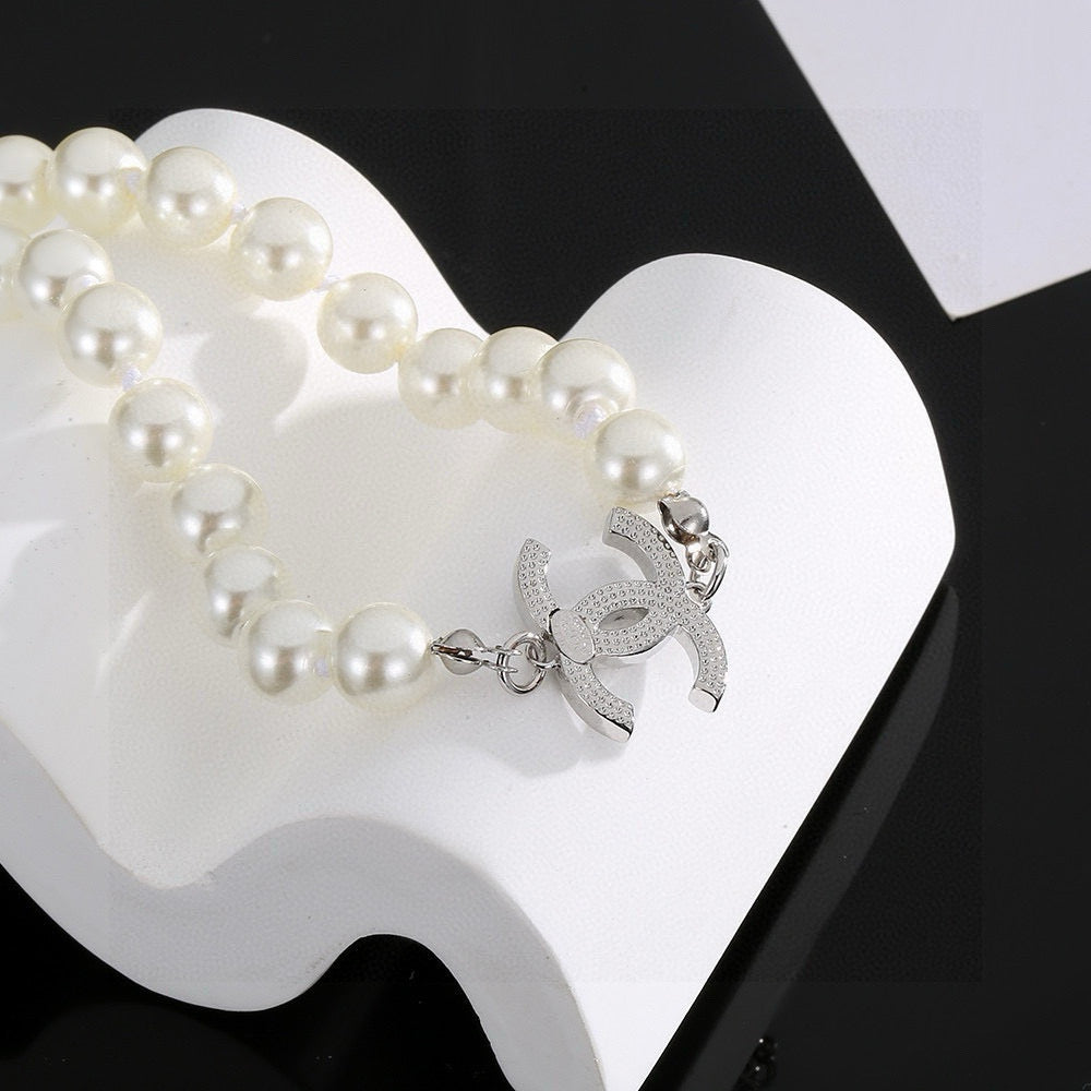 Double-C Emblem Pearl-Detail Pendant Necklace – Pearl Detail – Design 054 styled product view