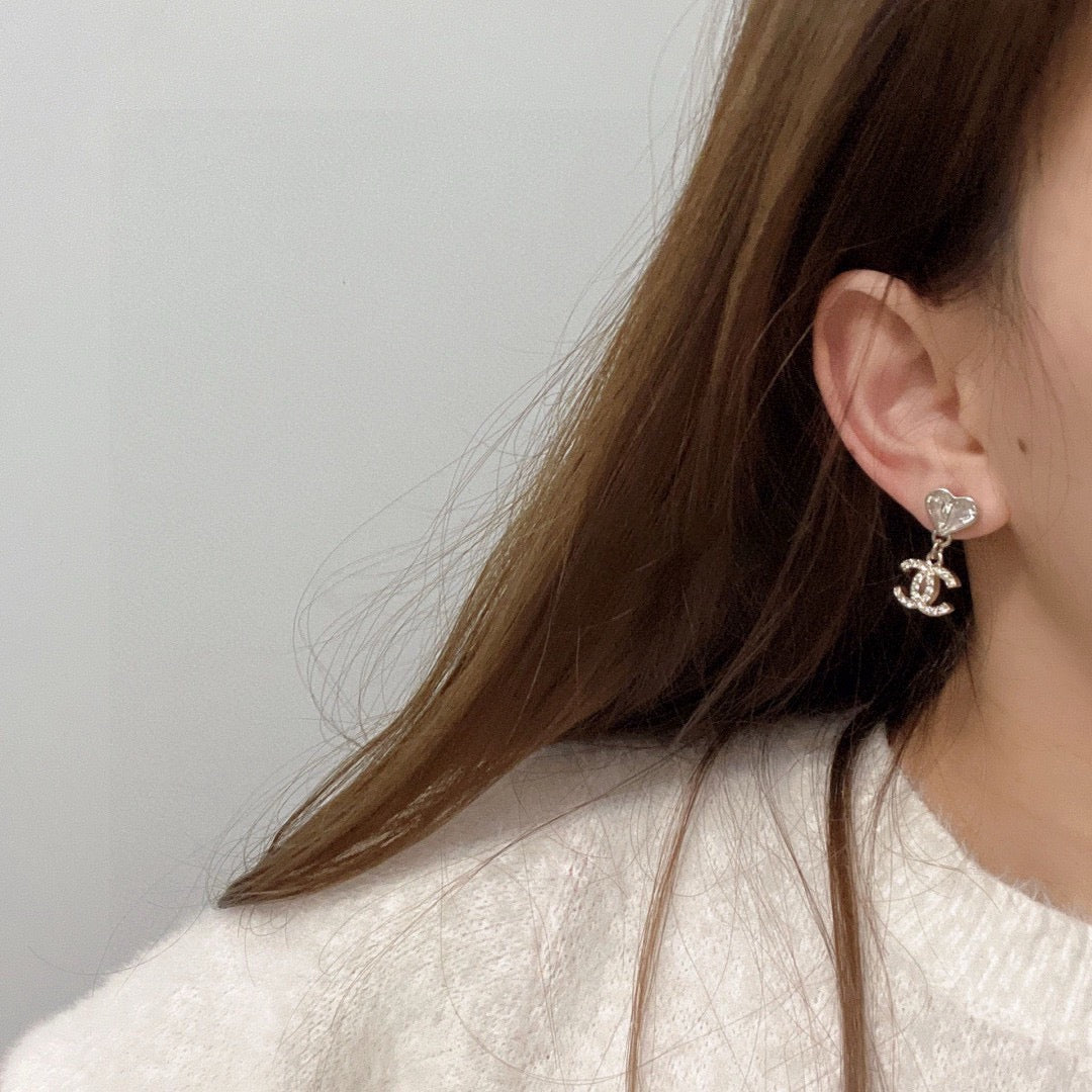 Double-C Emblem Stud Earrings in Polished Metal-Tone – Design 350 detail view