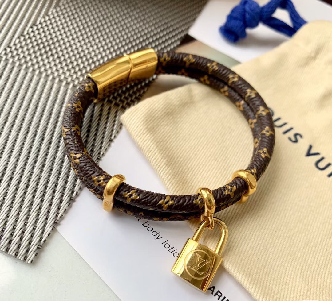 Letter Emblem Bangle in Polished Metal-Tone – Leather Detail – Design 002 detail view