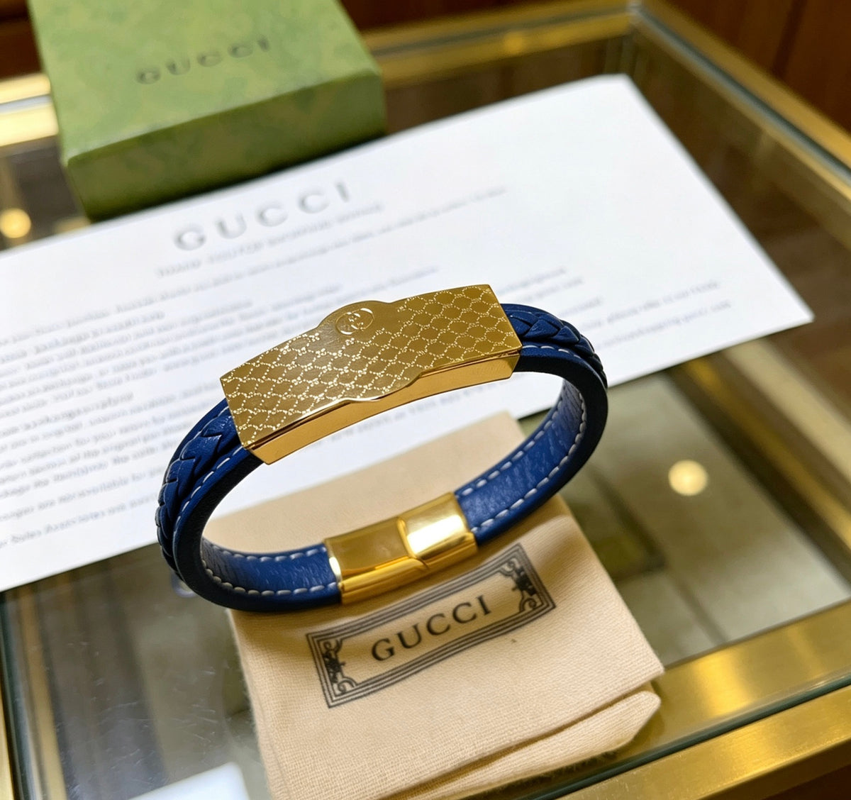 Double-G Emblem Bangle in Polished Metal-Tone – Leather Detail – Design 004 detail view