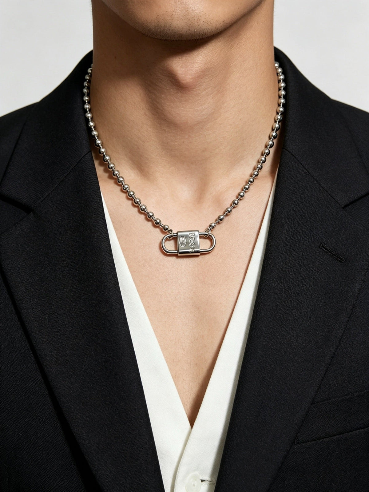 Martin Graham pendant necklace in polished metal-tone – side detail