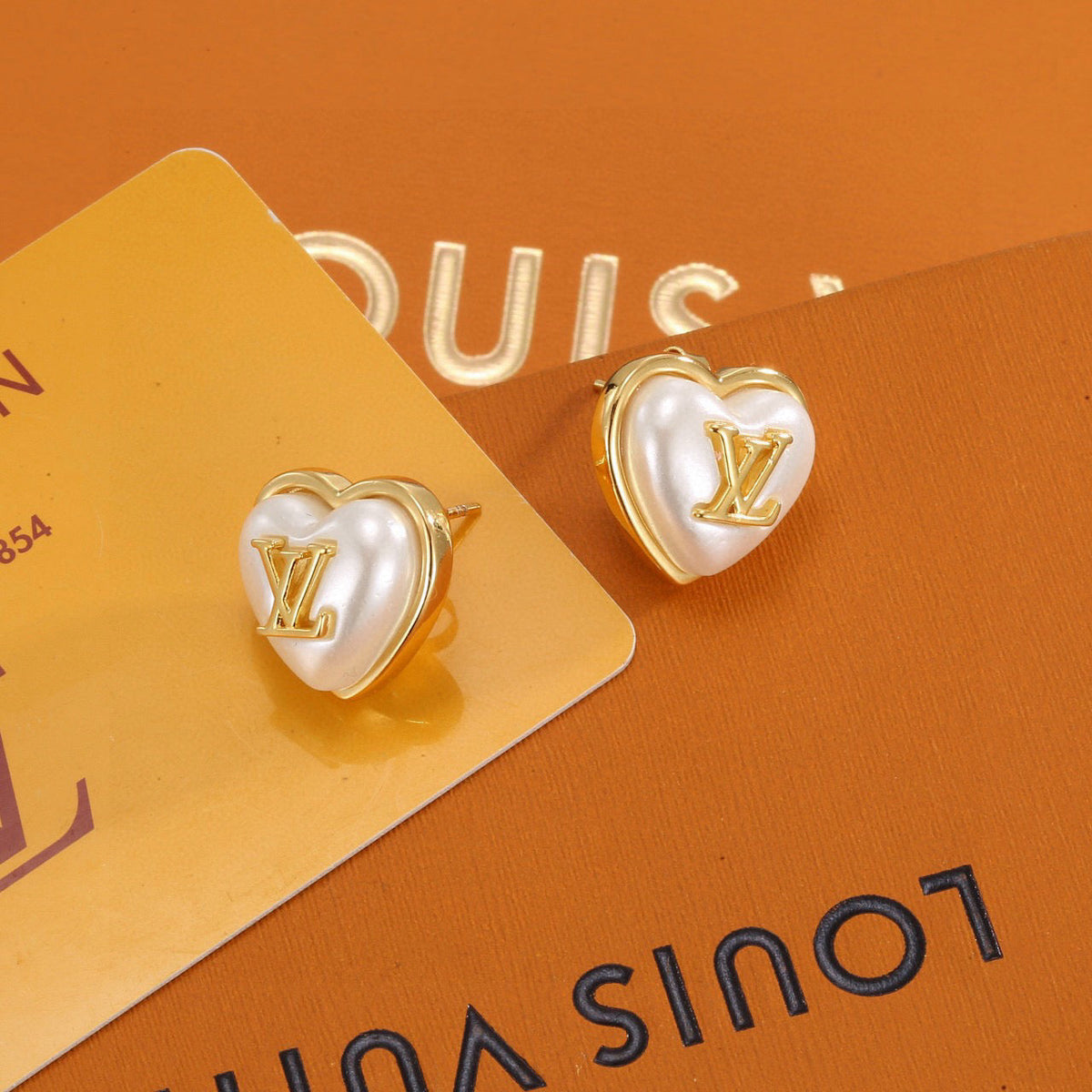 Martin Graham stud earrings in polished metal-tone – main product view