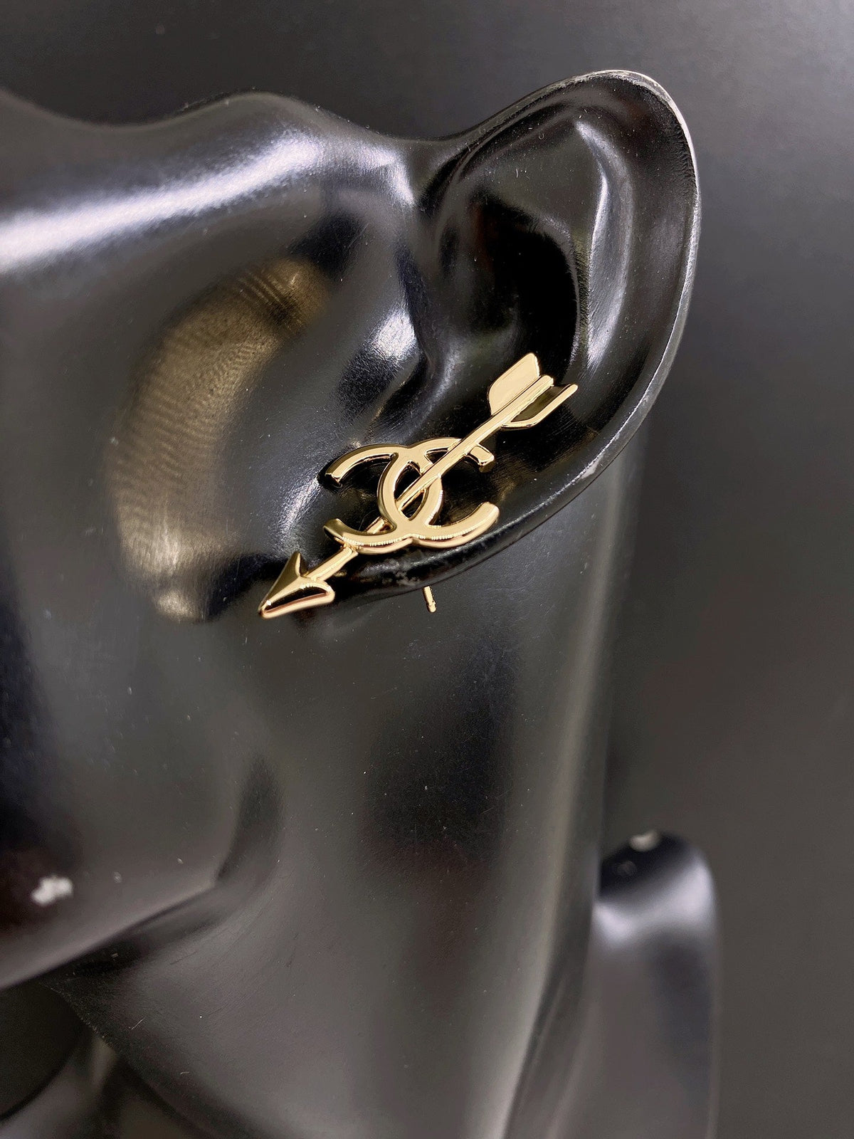 Martin Graham stud earrings in polished metal-tone – front product view