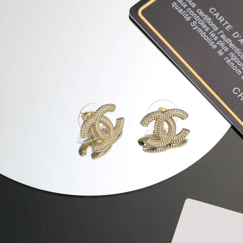 Martin Graham stud earrings in polished metal-tone – main product view