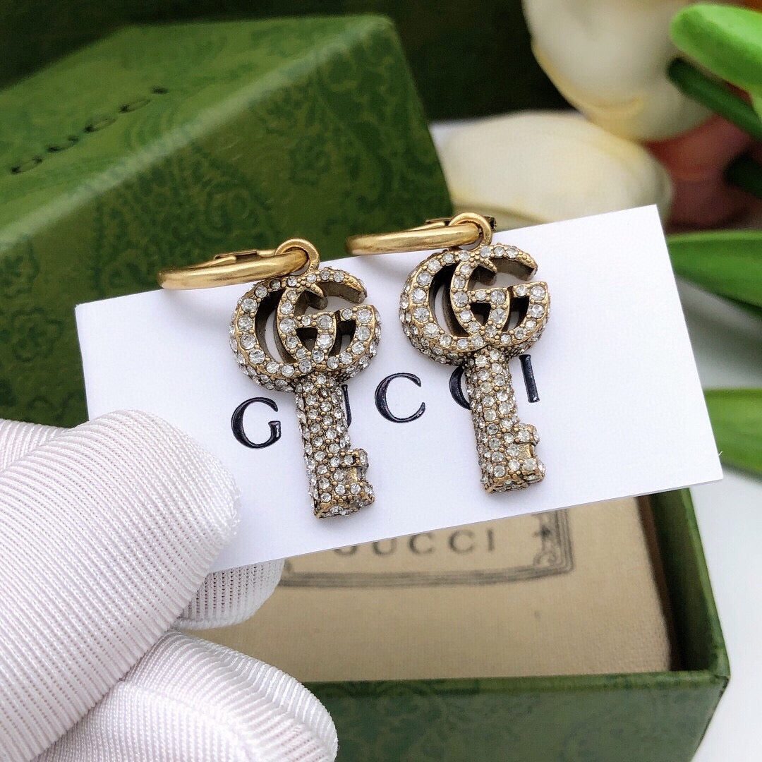 Martin Graham stud earrings in polished metal-tone – main product view