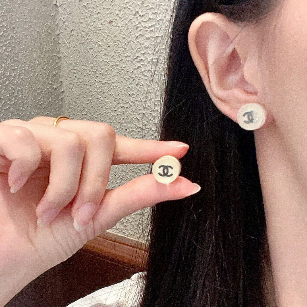 Martin Graham stud earrings in polished metal-tone – main product view