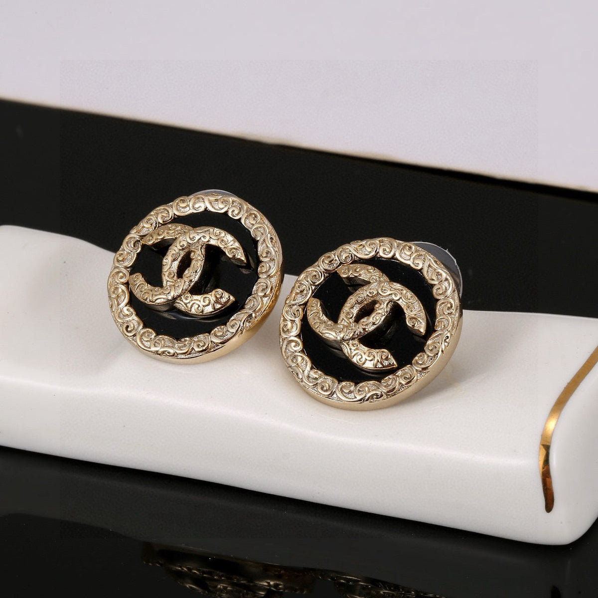 Martin Graham stud earrings in polished metal-tone – main product view