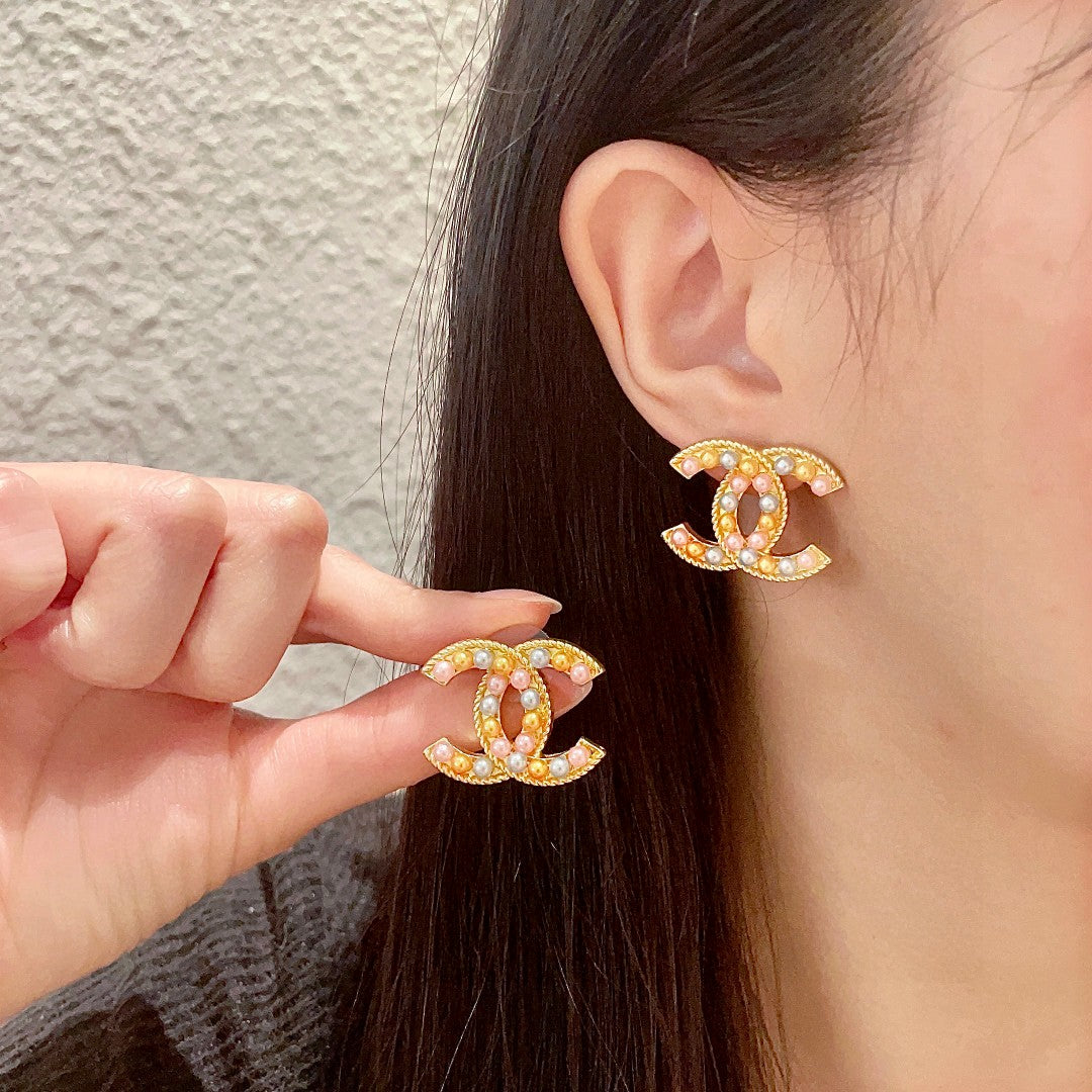 Martin Graham stud earrings in polished metal-tone – main product view