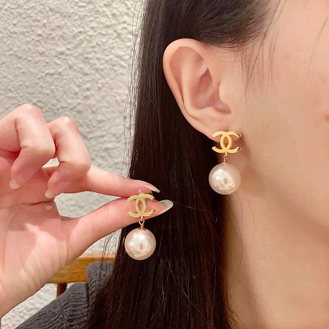 Martin Graham stud earrings in polished metal-tone – main product view