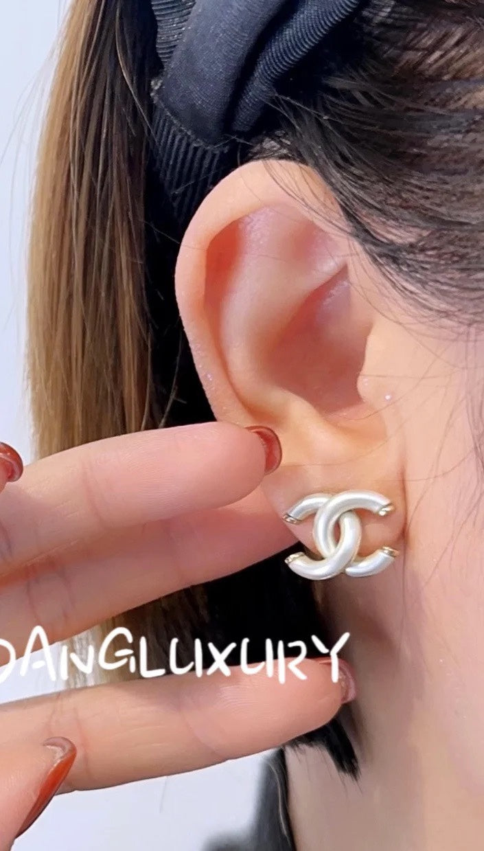Martin Graham stud earrings in polished metal-tone – main product view