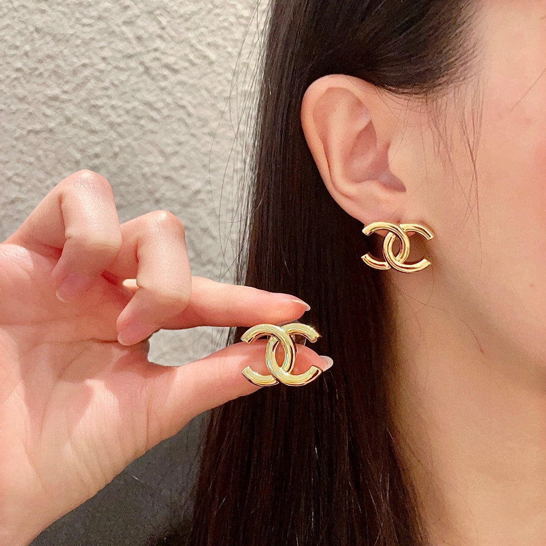 Martin Graham stud earrings in polished metal-tone – main product view