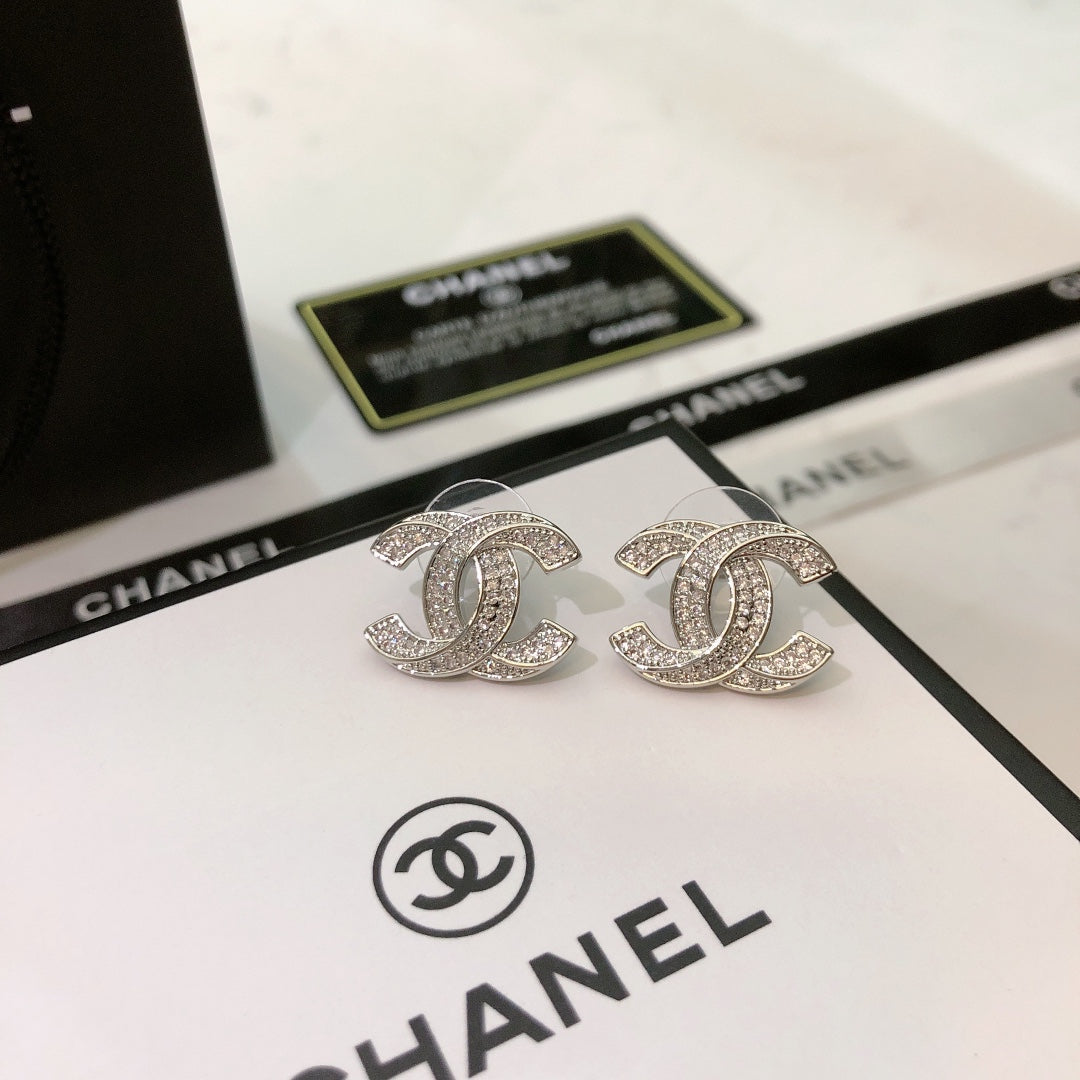 Martin Graham stud earrings in polished metal-tone – main product view