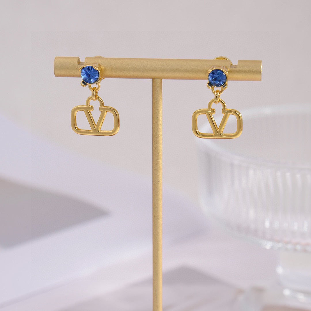 Martin Graham stud earrings in polished metal-tone – detail view
