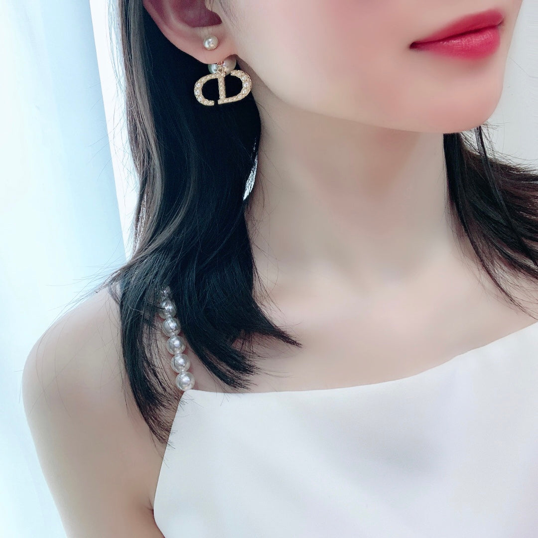Martin Graham stud earrings in polished metal-tone – side detail