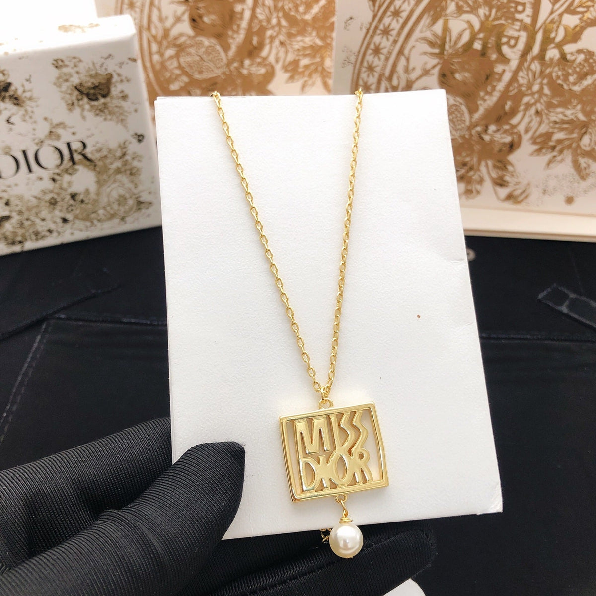 Martin Graham pendant necklace in polished metal-tone
