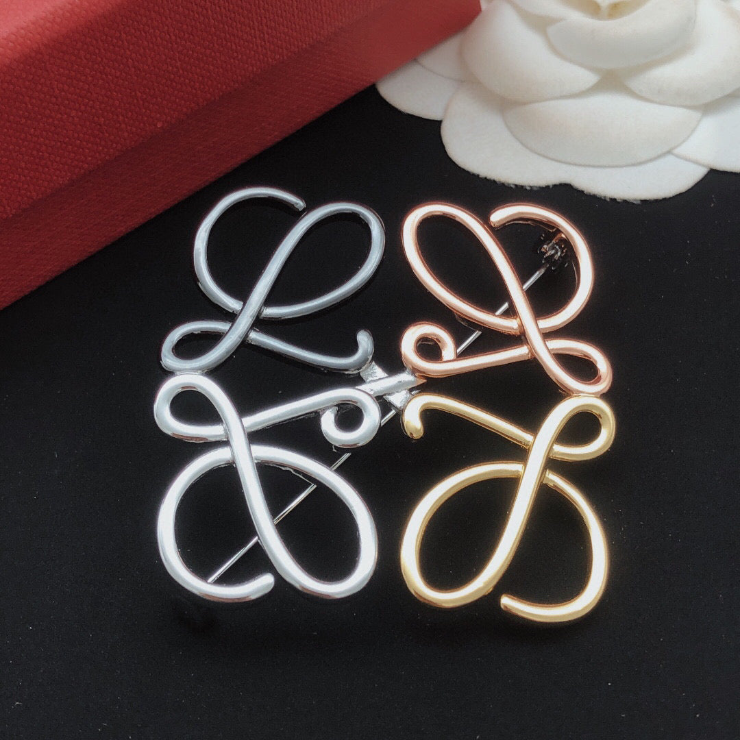 Martin Graham brooch in polished metal-tone