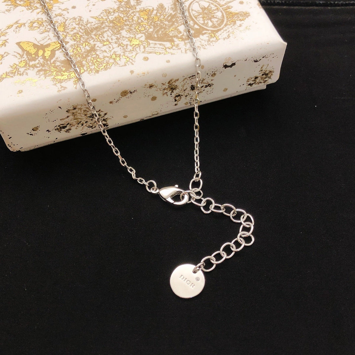Martin Graham pendant necklace in polished metal-tone – close-up detail