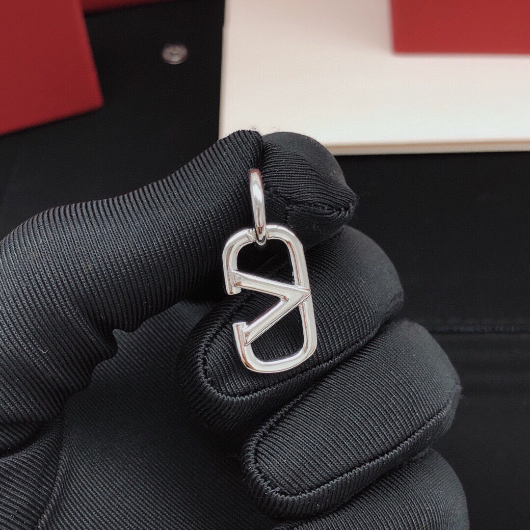 Martin Graham drop earrings in polished metal-tone