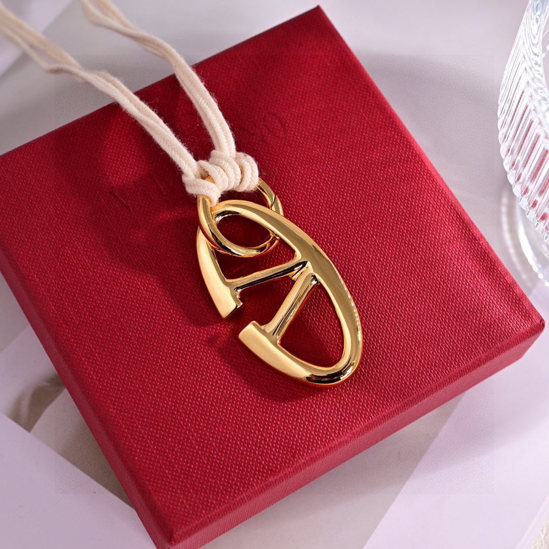 Martin Graham pendant necklace in polished metal-tone