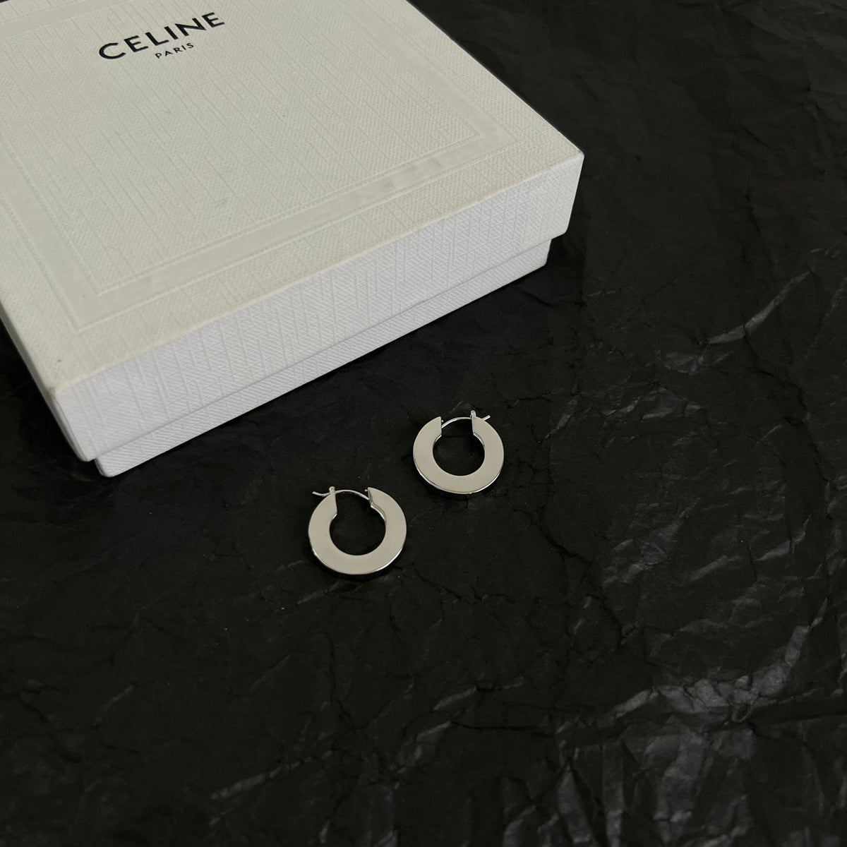 Martin Graham earrings in polished metal-tone