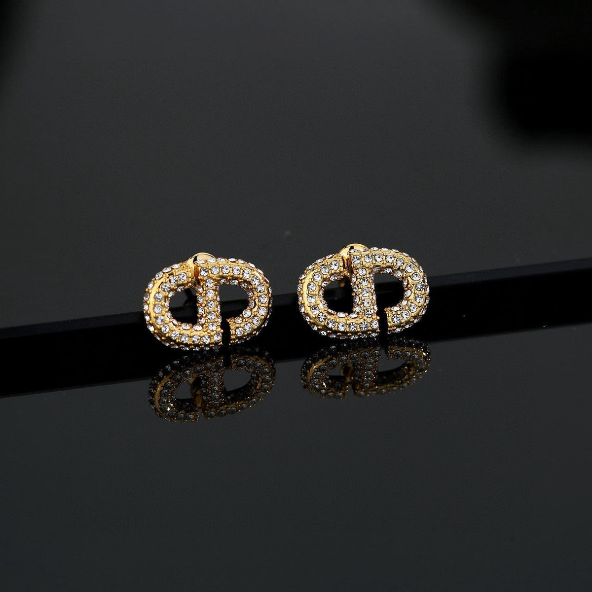 Martin Graham stud earrings in polished metal-tone – main product view