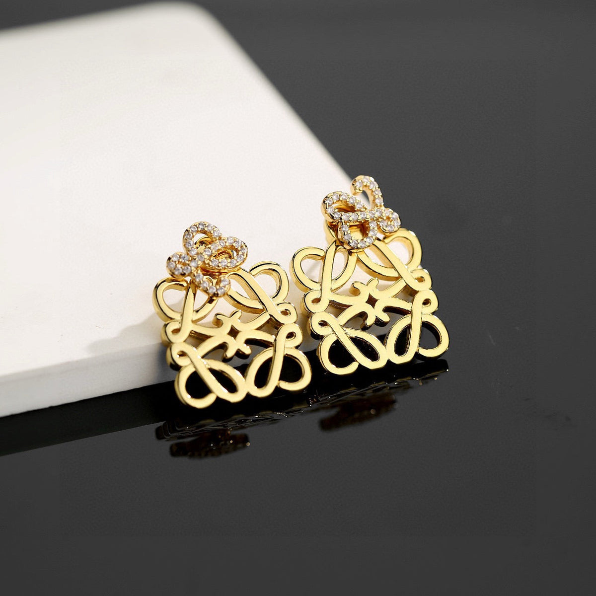 Martin Graham stud earrings in polished metal-tone – front view