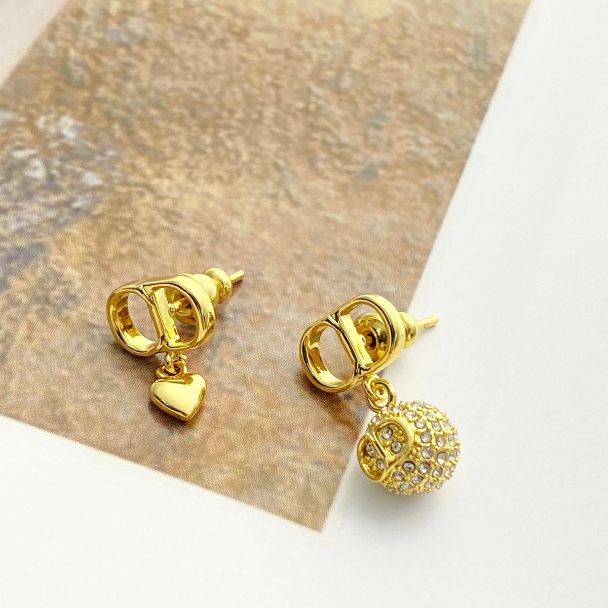 Martin Graham stud earrings in polished metal-tone – front view