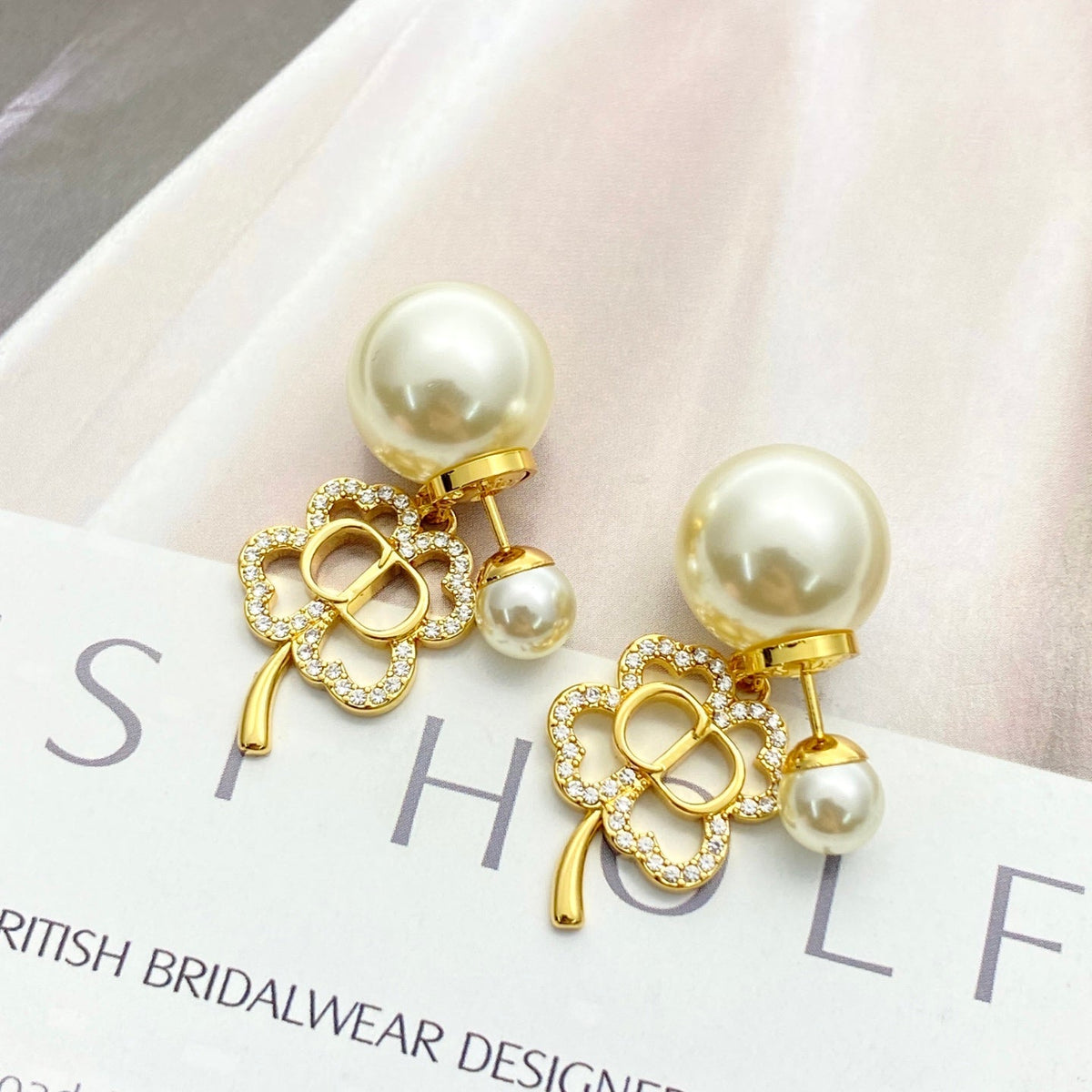 Martin Graham stud earrings in polished metal-tone – front view