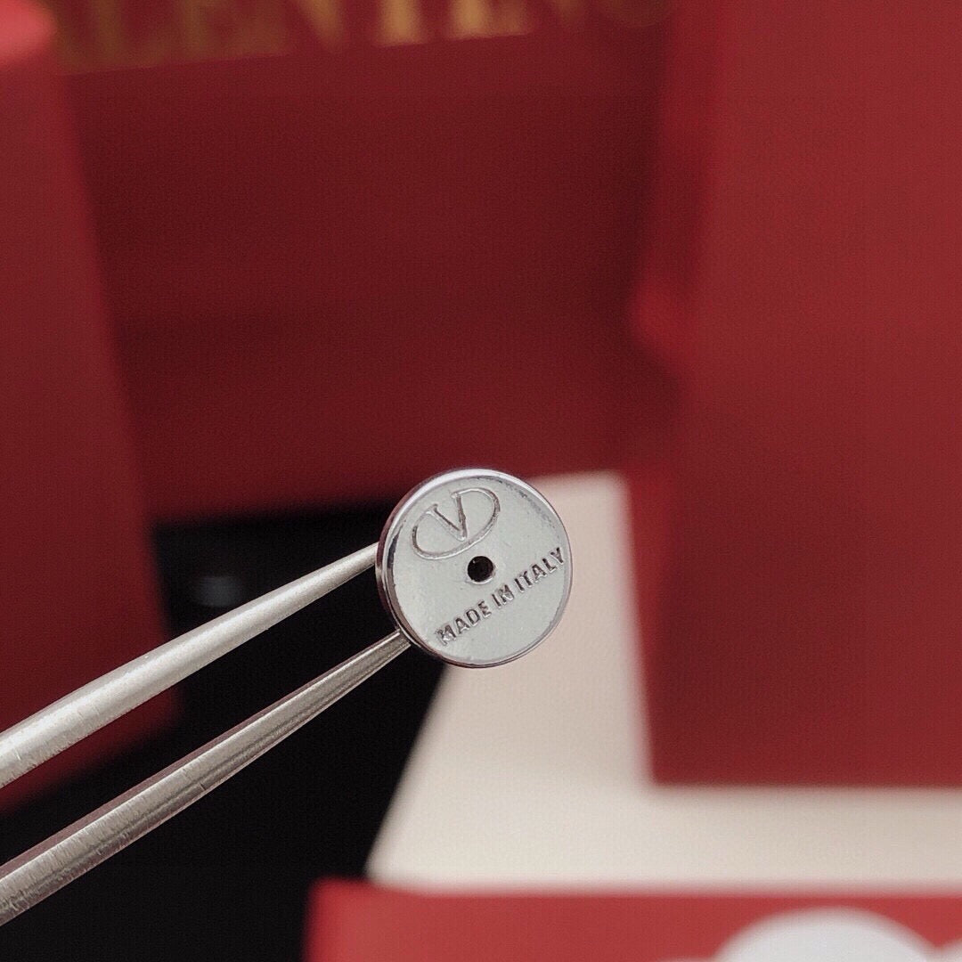 Martin Graham stud earrings in polished metal-tone – front view