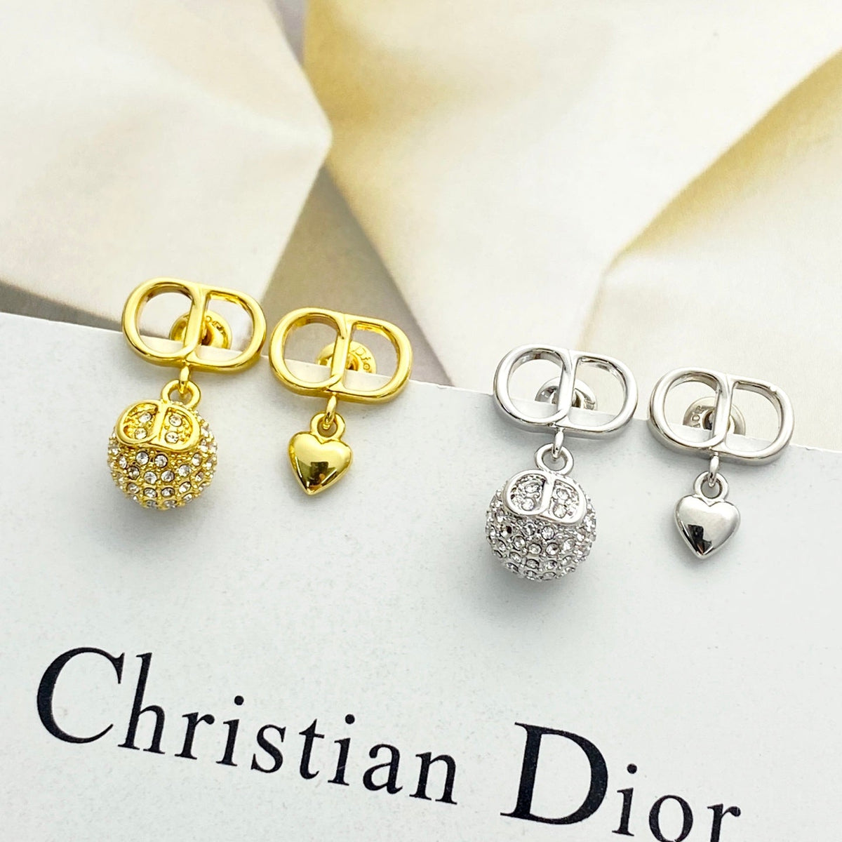 Martin Graham stud earrings in polished metal-tone – front view