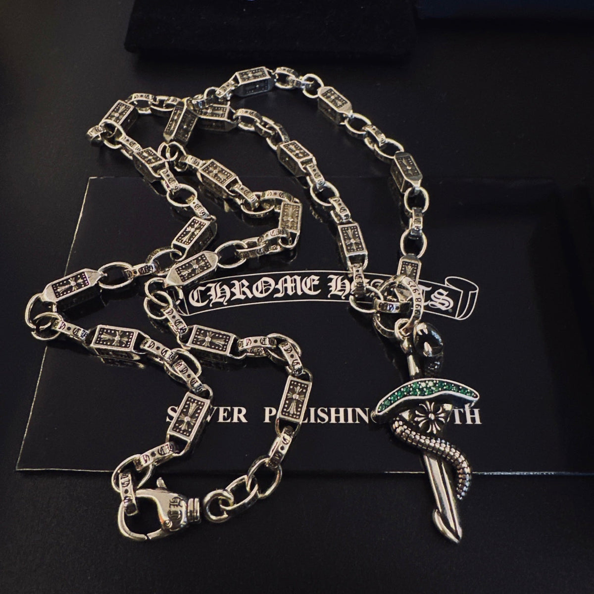 Martin Graham pendant necklace in polished metal-tone – detail view