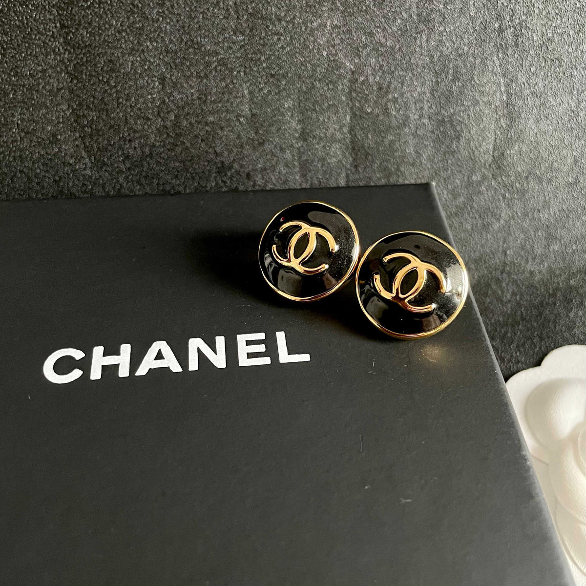 Martin Graham stud earrings in polished metal-tone – detail view