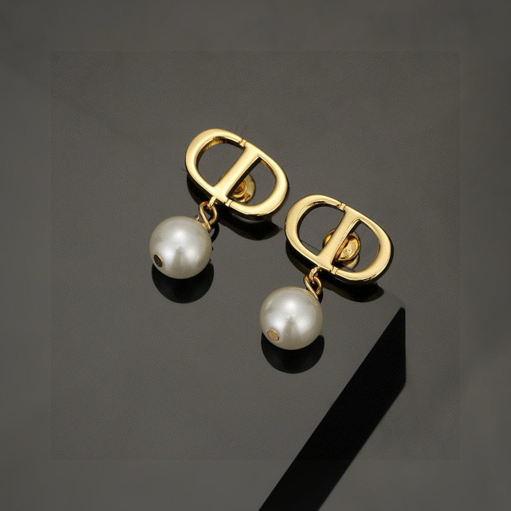 Martin Graham stud earrings in polished metal-tone – detail view