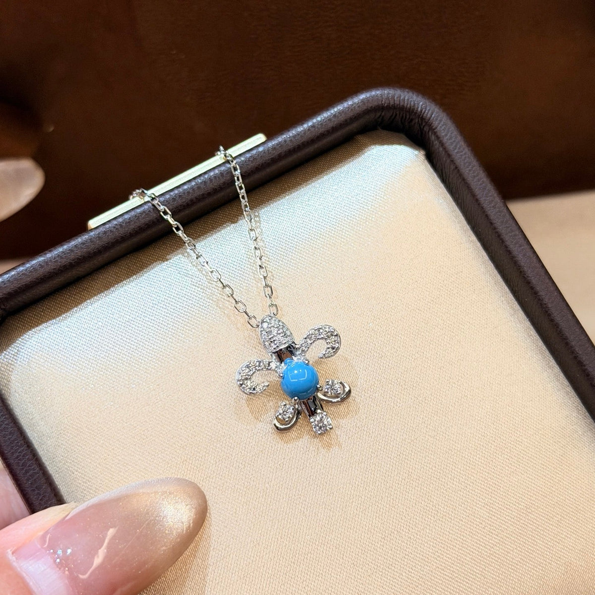 Martin Graham pendant necklace in polished metal-tone – detail view