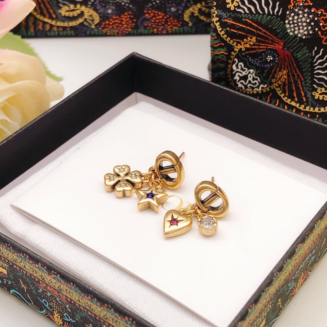 Martin Graham stud earrings in polished metal-tone – detail view