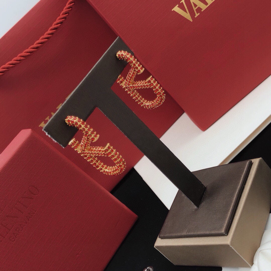 Martin Graham stud earrings in polished metal-tone – detail view