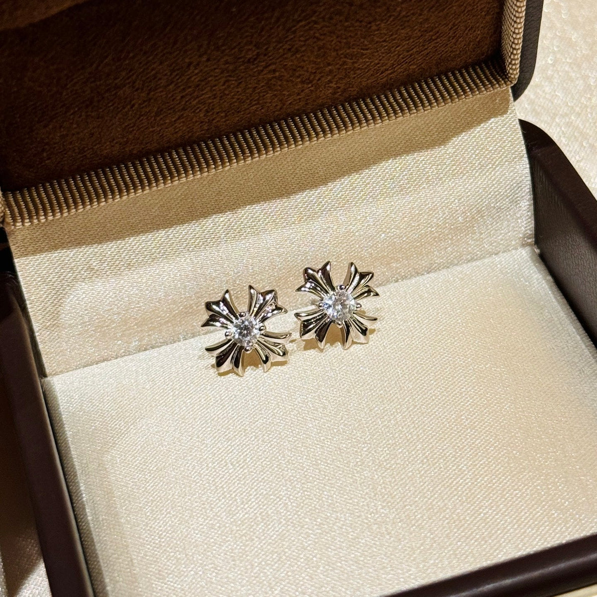 Martin Graham stud earrings in polished metal-tone – detail view