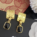 Letter Stud Earrings in Silver-Tone – Black Detail main product view
