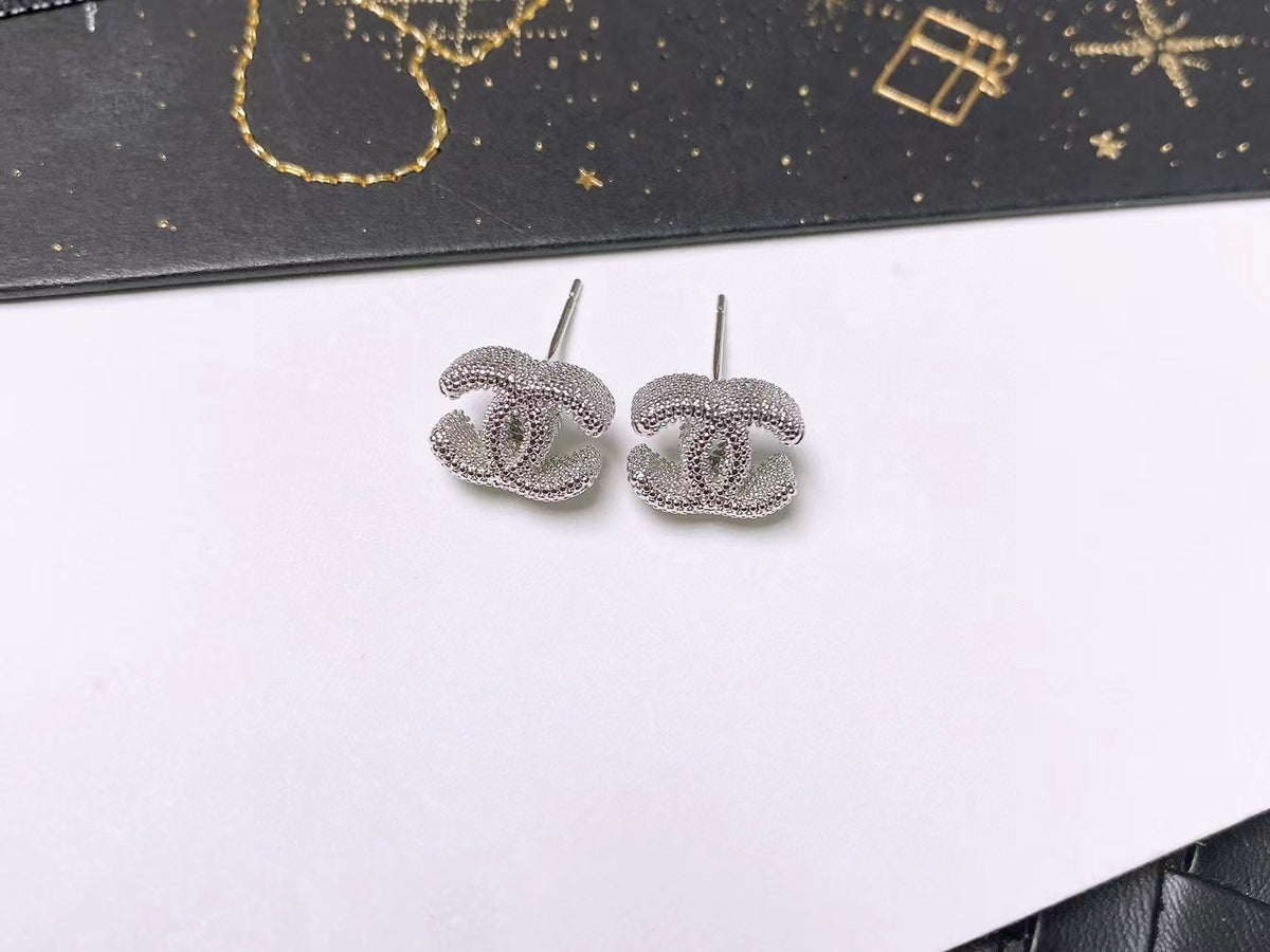 Signature Emblem Stud Earrings in Polished Metal-Tone – Design 110 close-up detail