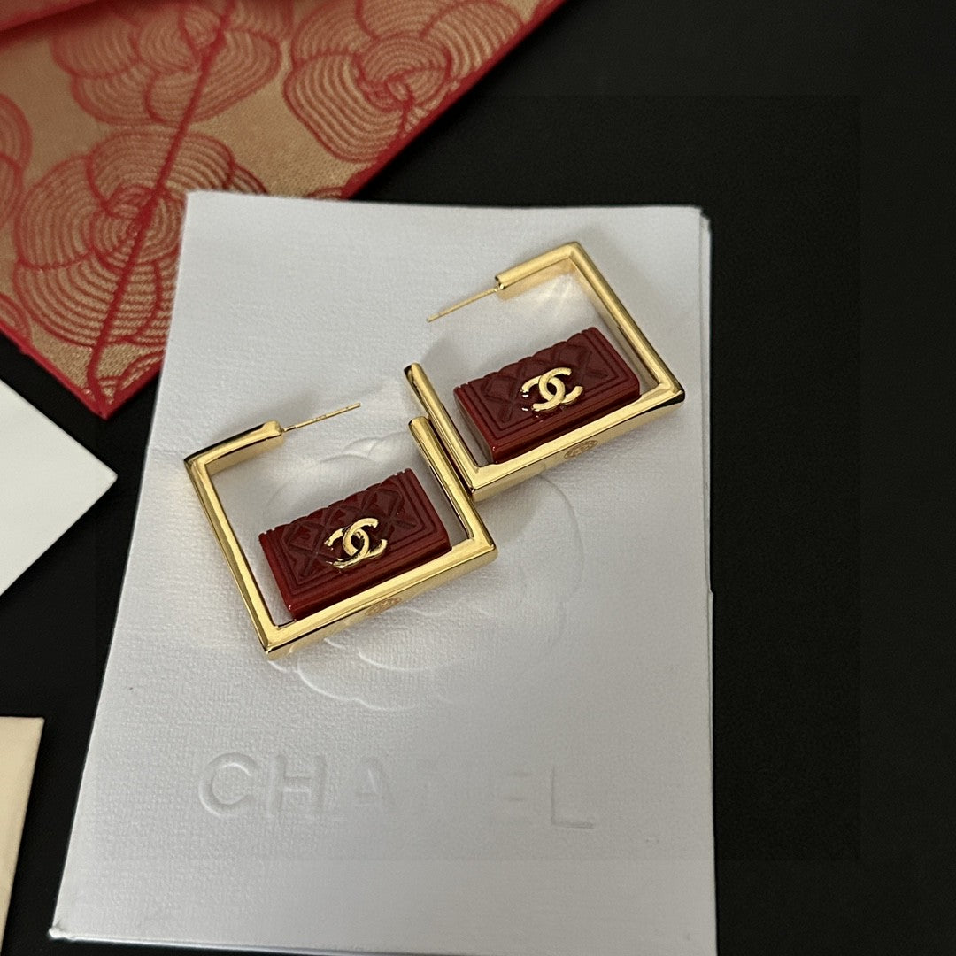 Double-C Emblem Stud Earrings in Polished Metal-Tone – Design 111 styled product view