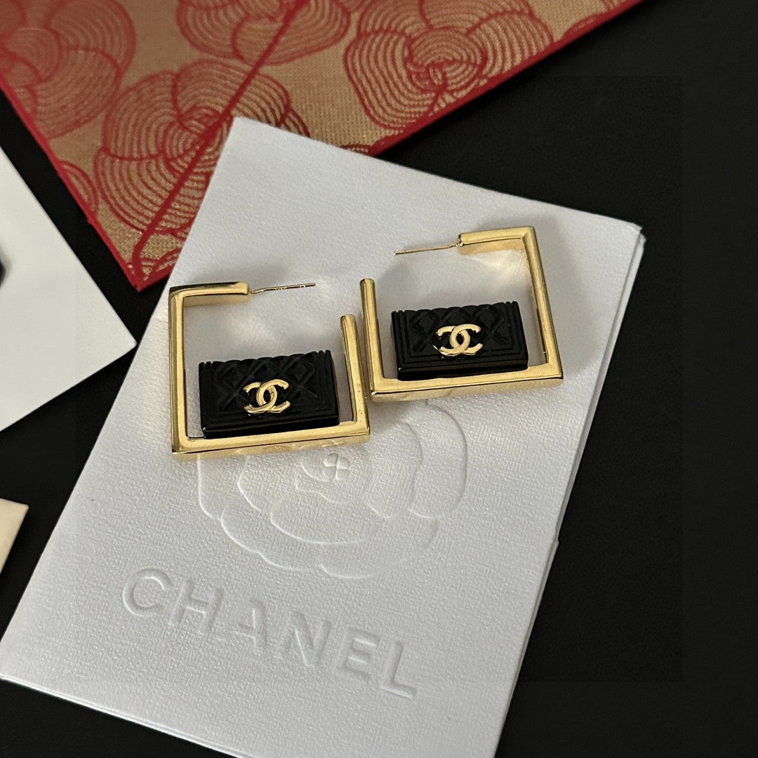 Double-C Emblem Stud Earrings in Polished Metal-Tone – Design 111 side detail
