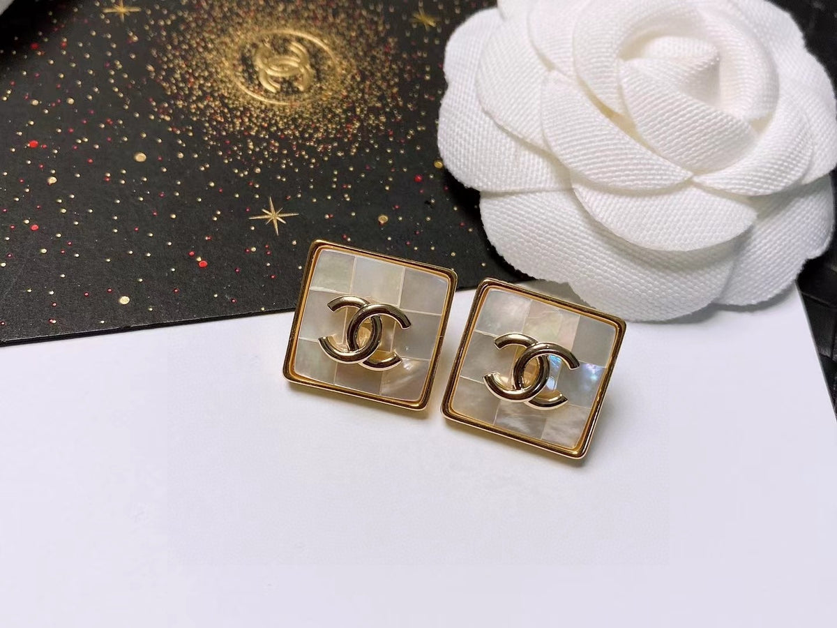 Signature Emblem Stud Earrings in Polished Metal-Tone – Design 012 detail view
