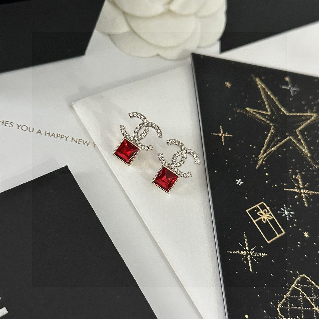 Double-C Emblem Stud Earrings in Polished Metal-Tone – Design 464 front product view