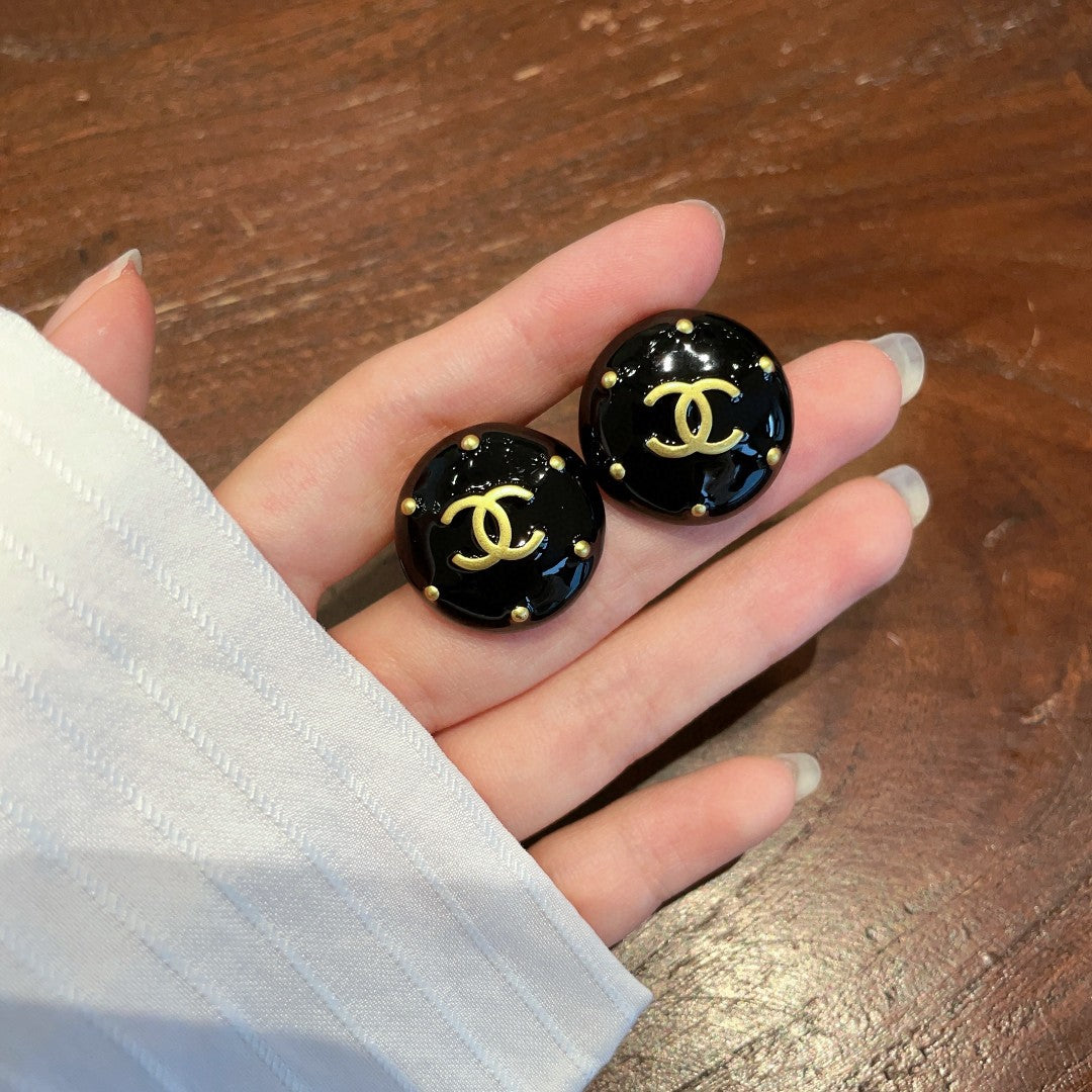 Double-C Emblem Stud Earrings in Polished Metal-Tone – Design 402 close-up detail