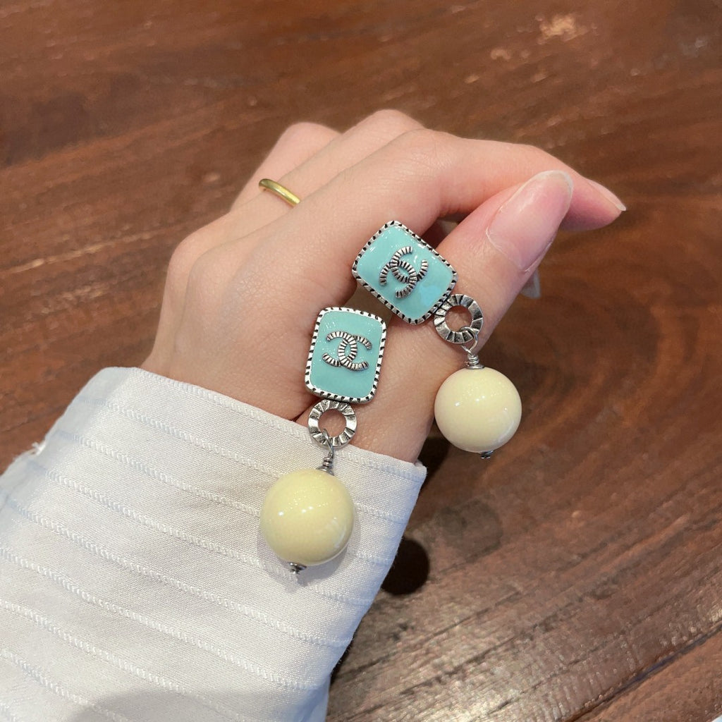 Double-C Emblem Pearl-Detail Statement Earrings – Pearl Detail – Design 030 side detail