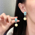 Double-C Emblem Pearl-Detail Statement Earrings – Pearl Detail – Design 030 main product view